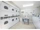 Well-maintained community laundry room featuring multiple washers and dryers for resident convenience at 6925-A Avenue Des Palais # 1A, South Pasadena, FL 33707