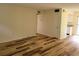 Bright living room featuring stylish wood-look flooring and neutral paint at 6925-A Avenue Des Palais # 1A, South Pasadena, FL 33707