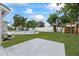 Backyard with a pool, grassy area, and partial fence at 7107 Limestone Ln, Tampa, FL 33619