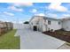 Exterior view of home with driveway and small garden at 7107 Limestone Ln, Tampa, FL 33619