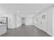 Living room features an open floor plan and new floors at 7107 Limestone Ln, Tampa, FL 33619