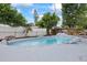Backyard pool with a dolphin statue and mature landscaping at 7107 Limestone Ln, Tampa, FL 33619