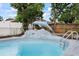 Close up of backyard pool featuring a dolphin statue at 7107 Limestone Ln, Tampa, FL 33619
