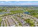Aerial view of a residential community near Tampa Bay with lakes, landscaping, and suburban homes at 7114 Bowspirit Pl, Apollo Beach, FL 33572