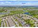 Breathtaking aerial view of homes in a suburban community near Tampa Bay, complete with scenic lakes and green spaces at 7114 Bowspirit Pl, Apollo Beach, FL 33572