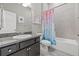 Bathroom with a granite countertop vanity, tile flooring, and a shower/tub combination at 7114 Bowspirit Pl, Apollo Beach, FL 33572