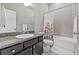 Bathroom featuring a vanity with granite countertop, tile flooring, and a shower/tub combination at 7114 Bowspirit Pl, Apollo Beach, FL 33572