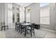 Elegant dining room with high ceilings and lots of natural light, perfect for entertaining at 7114 Bowspirit Pl, Apollo Beach, FL 33572