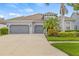 Charming single Gathering home with a three car garage and lush tropical landscaping at 7114 Bowspirit Pl, Apollo Beach, FL 33572