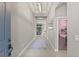 Inviting entryway and hallway with views into the living room and a bedroom at 7114 Bowspirit Pl, Apollo Beach, FL 33572