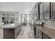 Contemporary kitchen with granite countertops, stainless steel appliances, and seamless access to living spaces at 7114 Bowspirit Pl, Apollo Beach, FL 33572