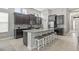 Well-equipped kitchen featuring a central island with seating and ample cabinet space at 7114 Bowspirit Pl, Apollo Beach, FL 33572