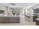Bright and airy living room featuring an open floor plan and large windows at 7114 Bowspirit Pl, Apollo Beach, FL 33572