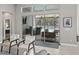 Bright living room showcasing access to the outdoor kitchen, pool, and patio area at 7114 Bowspirit Pl, Apollo Beach, FL 33572
