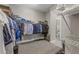Spacious walk-in closet featuring shelving, hanging rods, and ample storage for clothing and accessories at 7114 Bowspirit Pl, Apollo Beach, FL 33572