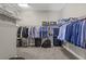 Large walk-in closet with custom shelving and ample storage space for clothing and accessories at 7114 Bowspirit Pl, Apollo Beach, FL 33572