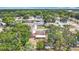 Wide aerial shot showcasing home and surrounding neighborhood, lush greenery, and convenient location close to parks and amenities at 7206 Timber Ct, Tampa, FL 33625