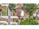Overhead view of the property highlighting its mature trees, a fully fenced yard, and location within a residential neighborhood at 7206 Timber Ct, Tampa, FL 33625
