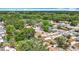 Features an aerial view of a residential neighborhood with lush greenery and well-maintained homes at 7206 Timber Ct, Tampa, FL 33625