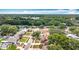 Aerial view showing a neighborhood, lush trees, and proximity to roadways at 7206 Timber Ct, Tampa, FL 33625