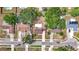 Overhead view of the property highlighting its mature trees, a fully fenced yard, and location within a residential neighborhood at 7206 Timber Ct, Tampa, FL 33625