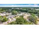 Aerial view showing a neighborhood, lush trees, and proximity to roadways at 7206 Timber Ct, Tampa, FL 33625