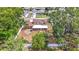 Aerial view of the property showcasing a well-maintained, fully fenced backyard and mature trees, highlighting its outdoor appeal at 7206 Timber Ct, Tampa, FL 33625