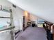 Multi-use attic with sloped ceilings can serve as an office or entertainment space at 7206 Timber Ct, Tampa, FL 33625