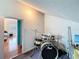 An airy, finished attic space with drums adjacent to a bedroom, offering versatility for creative hobbies at 7206 Timber Ct, Tampa, FL 33625