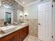 Modern bathroom featuring double sinks, granite countertops, and stylish design at 7206 Timber Ct, Tampa, FL 33625