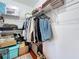 Walk in closet with shelving and clothes at 7206 Timber Ct, Tampa, FL 33625