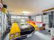 Spacious garage with ample storage and classic vehicles, offering a blend of functionality and vintage charm at 7206 Timber Ct, Tampa, FL 33625
