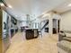Spacious kitchen with dark cabinets, stainless steel appliances, large island and tile flooring at 7206 Timber Ct, Tampa, FL 33625