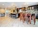 Spacious kitchen with granite countertops, stainless steel appliances, and ample seating at 7206 Timber Ct, Tampa, FL 33625