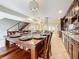 Open concept kitchen and dining area with dark wood finishes and modern fixtures at 7206 Timber Ct, Tampa, FL 33625
