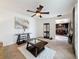 Cozy living room that flows into the kitchen, with comfortable seating and stylish decor at 7206 Timber Ct, Tampa, FL 33625