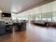 Spacious sunroom with tile floors, lounge furniture, and large windows, perfect for year-round enjoyment at 7206 Timber Ct, Tampa, FL 33625
