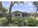 View of the home's exterior, with a focus on the fenced-in backyard at 7625 Marechal Ave, Port Richey, FL 34668