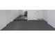 Clean basement space, featuring painted walls and floors at 7625 Marechal Ave, Port Richey, FL 34668