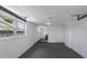 Finished basement, featuring painted walls, floors, and multiple doorways at 7625 Marechal Ave, Port Richey, FL 34668