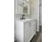 This bathroom features a white cabinet and silver hardware at 7625 Marechal Ave, Port Richey, FL 34668