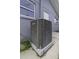Side exterior view of new Lennox air conditioner unit at 7625 Marechal Ave, Port Richey, FL 34668