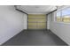 Spacious two car garage with automatic door and window providing natural light at 7625 Marechal Ave, Port Richey, FL 34668