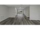 Bright and airy living room with laminate flooring and lots of natural light at 7625 Marechal Ave, Port Richey, FL 34668