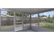 View from inside the screened-in porch overlooking the backyard at 7625 Marechal Ave, Port Richey, FL 34668