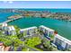 Desirable waterfront condo community featuring lush landscaping, parking, and water views at 7892 Sailboat Key S Blvd # 408, South Pasadena, FL 33707