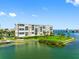 Gorgeous waterfront condo building on a scenic point with lush landscaping and water views at 7892 Sailboat Key S Blvd # 408, South Pasadena, FL 33707