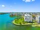 Beautiful waterfront condo community surrounded by water, lush landscaping, and city views at 7892 Sailboat Key S Blvd # 408, South Pasadena, FL 33707