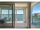 Outdoor balcony with a waterfront view featuring seating at 7892 Sailboat Key S Blvd # 408, South Pasadena, FL 33707