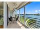 Relaxing balcony with seating overlooking lush landscaping and tranquil waterfront at 7892 Sailboat Key S Blvd # 408, South Pasadena, FL 33707